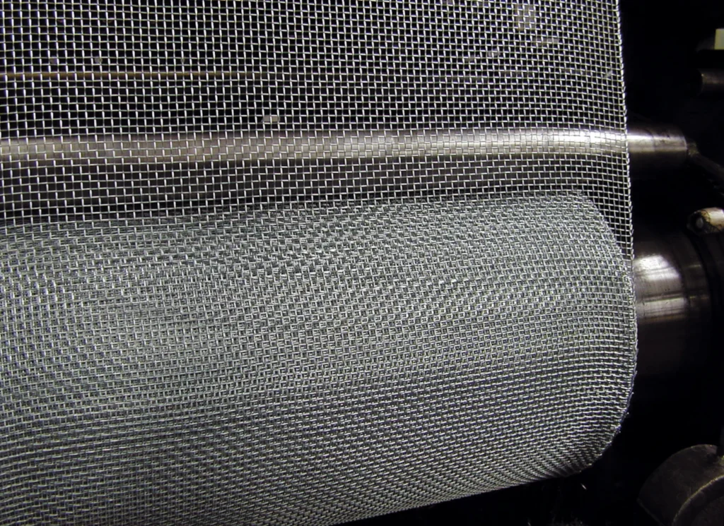 Detail of metal knitted mesh in industrial production line